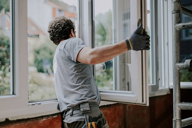 Crew installing replacement windows on a Naperville family home during exterior upgrade, Crew replacing older front windows on occupied Tinley Park suburban home