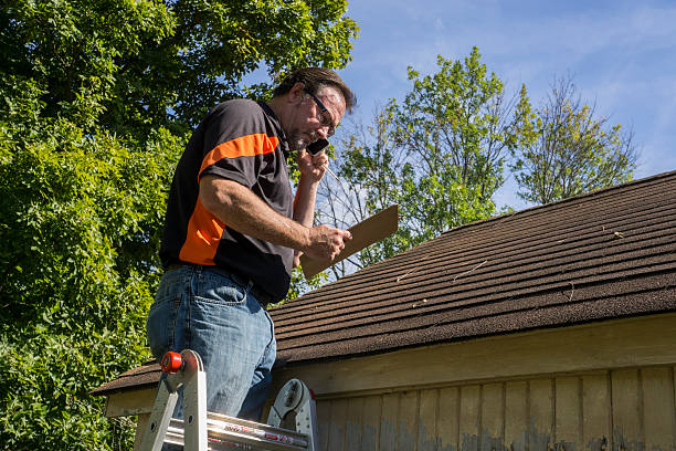Crew repairing wind-damaged shingles on a family home after a Plainfield storm