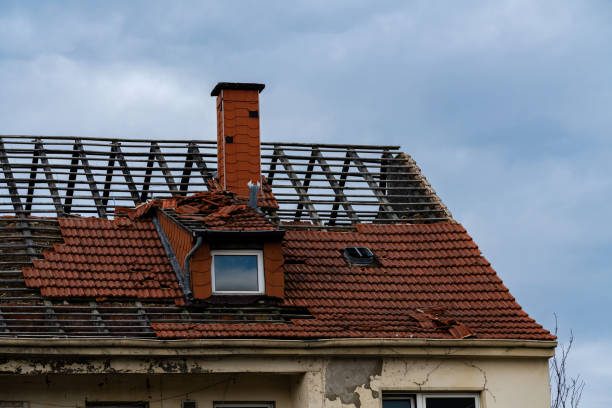 Roof Storm Damage Repair in Mount Pleasant - WI as a crew secures tarp protection over missing shingles